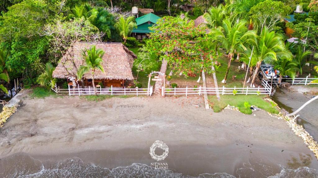 an aerial view of a house on the beach at Nirvana Resort in Lívingston