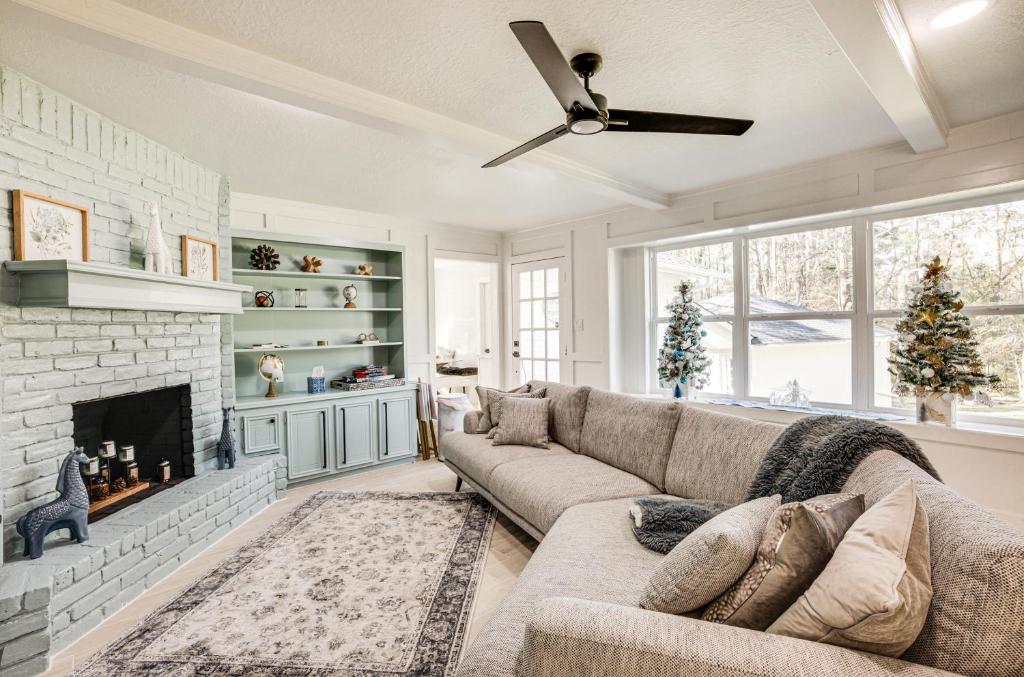 a living room with a couch and a fireplace at Quiet Texas Vacation Rental about 5 Mi to Lake Conroe! in Conroe