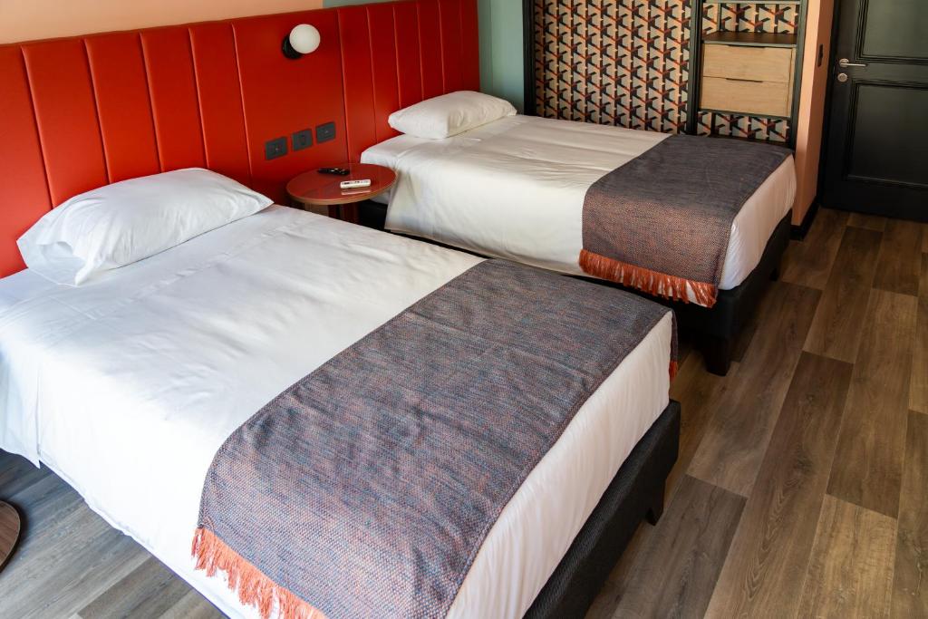 Postel nebo postele na pokoji v ubytování APT Serviced Apartments Santiago