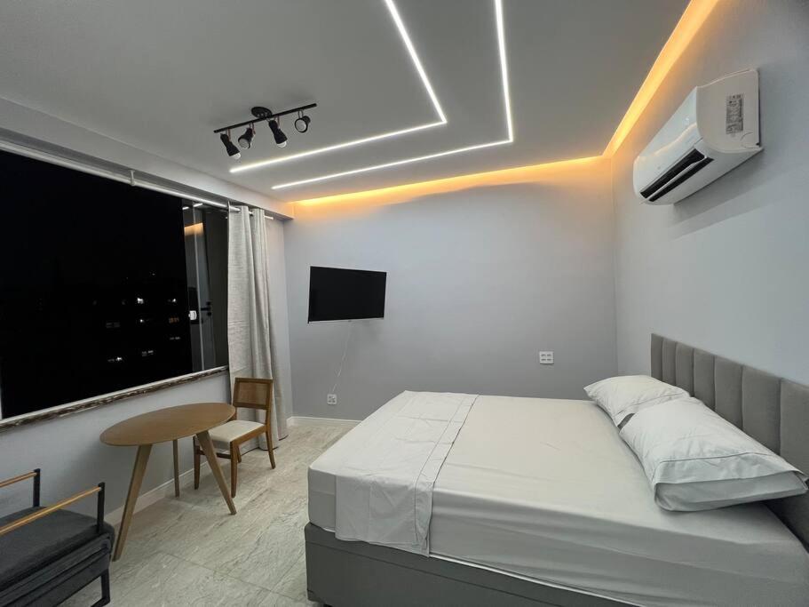Un pat sau paturi într-o cameră la Studio Dowtown tech Rio