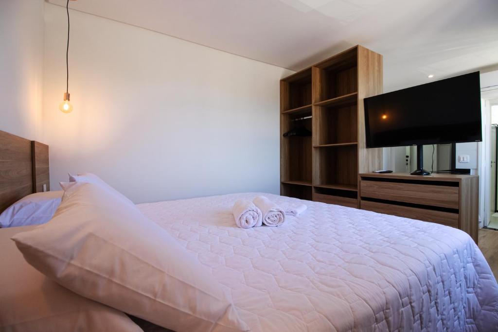 Postel nebo postele na pokoji v ubytování Ilhéus Praia Hotel