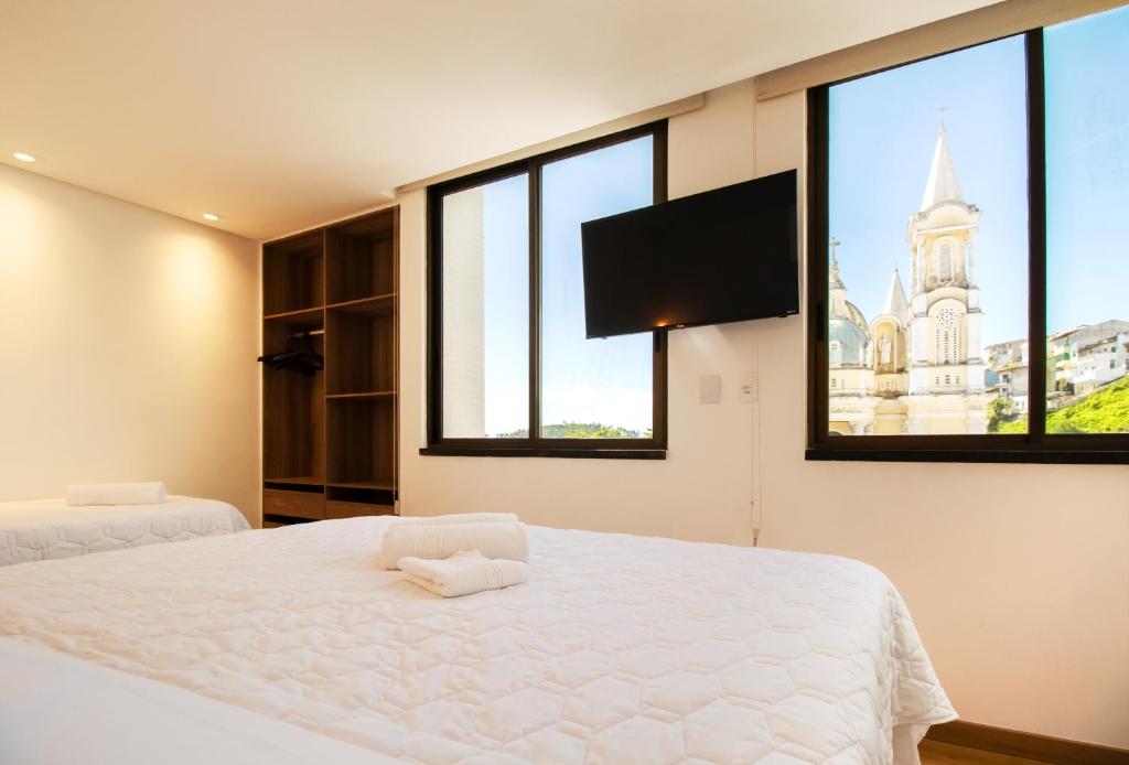 Postel nebo postele na pokoji v ubytování Ilhéus Praia Hotel
