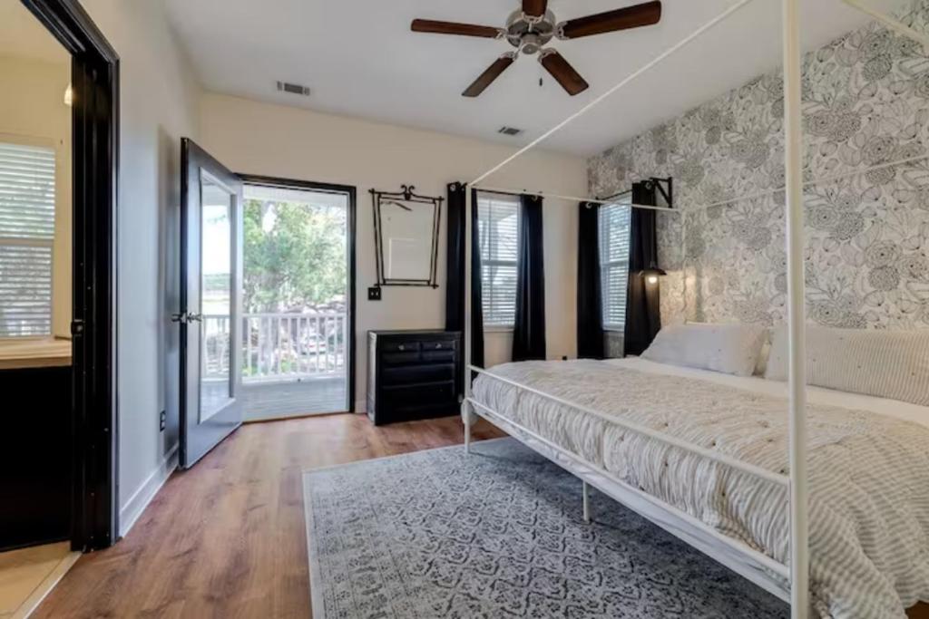 a bedroom with a bed and a ceiling fan at Honey, I’m Home near Savannah - Seen on HGTV in Savannah