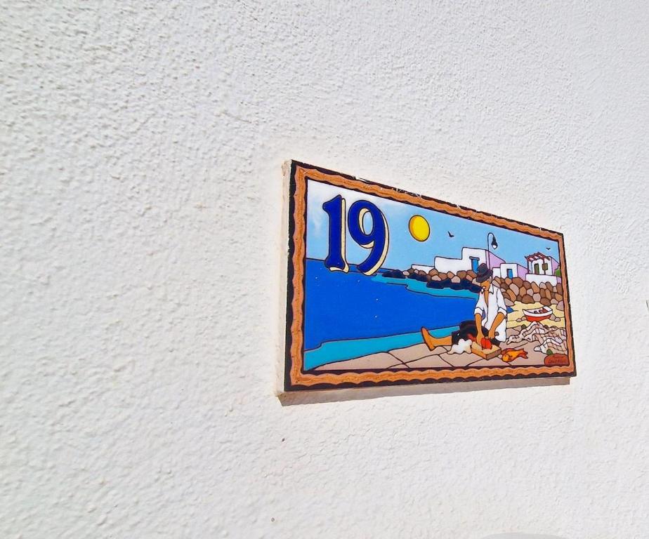 a sign on a wall that says on it at El poniente in Caleta de Sebo