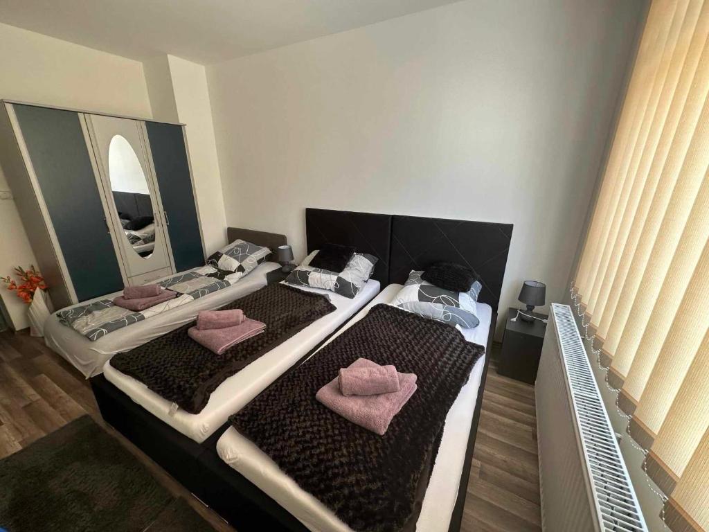 Postel nebo postele na pokoji v ubytování Rena Vendégház