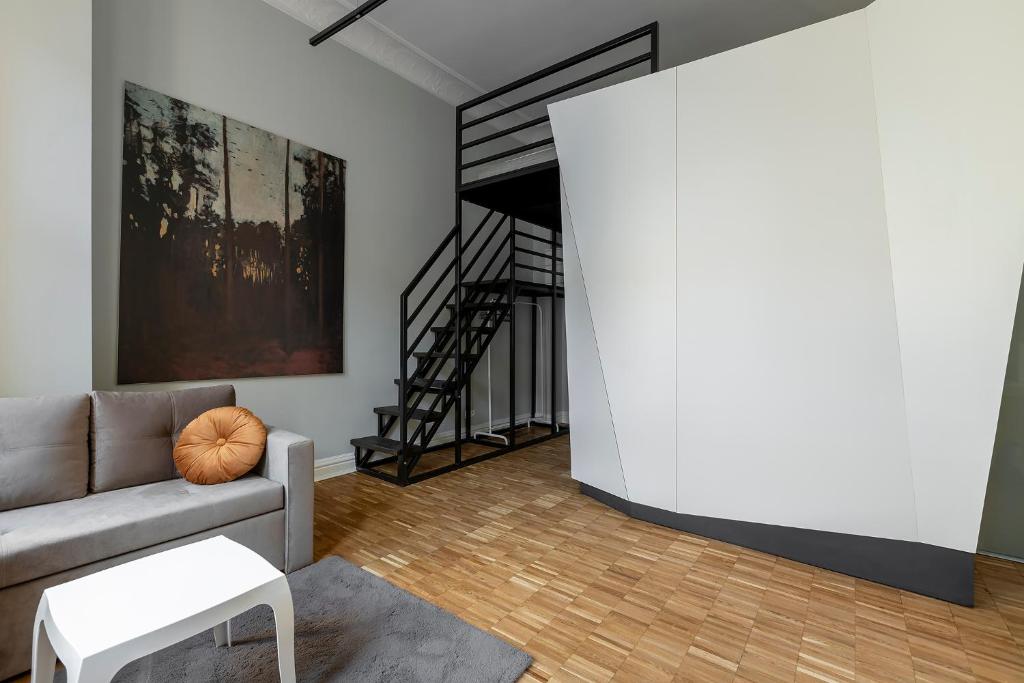 Χώρος καθιστικού στο Chełmońskiego 8-04 by Farkas Apartments