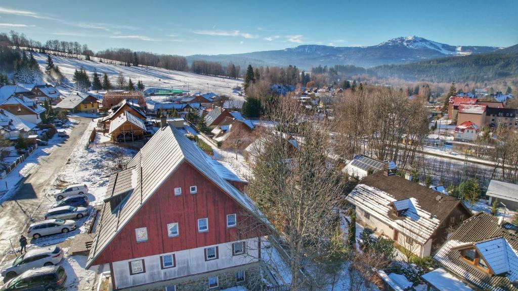 an aerial view of a small town in the snow at Apartmány chata Samoty in Železná Ruda