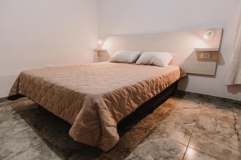 a bedroom with a large bed in a room at Boulevard Six in General Pico