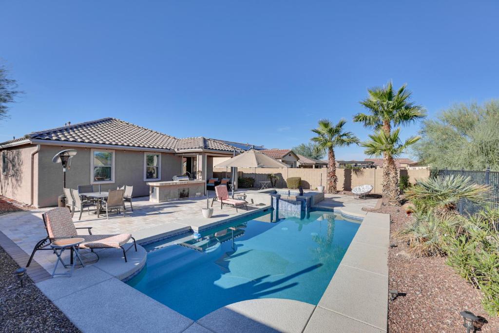 a swimming pool in the backyard of a house at Goodyear Home with Patio - Near Estrella Mountain! in Liberty