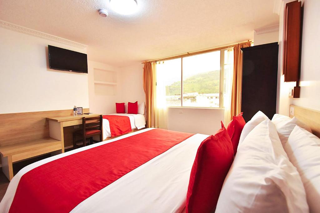 Postel nebo postele na pokoji v ubytování Hotel Plaza Victoria