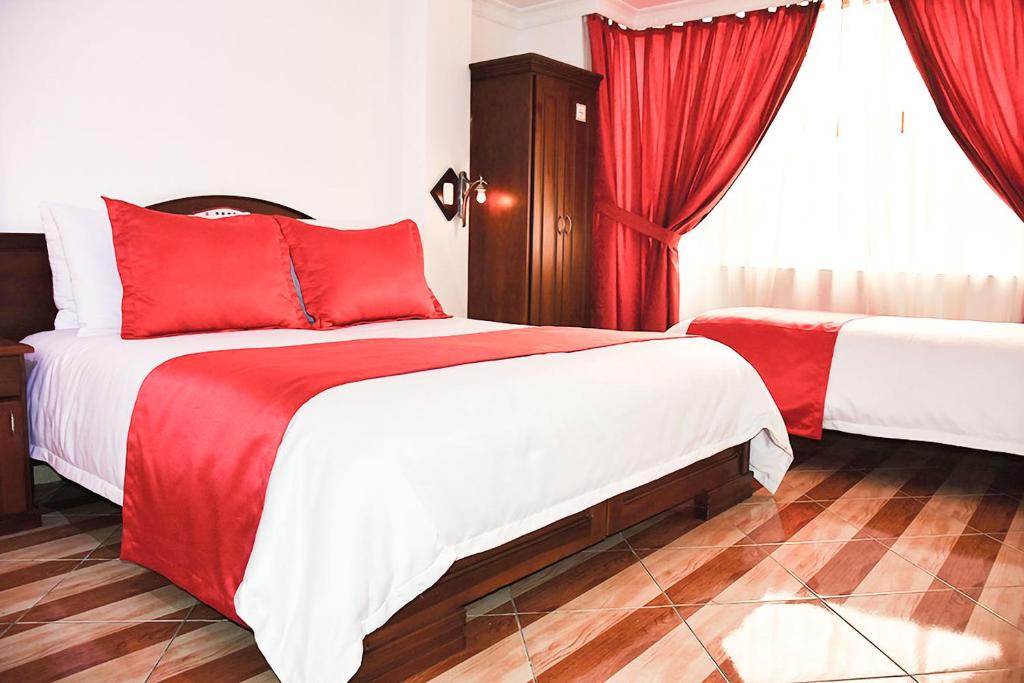 Postel nebo postele na pokoji v ubytování Hotel Plaza Victoria