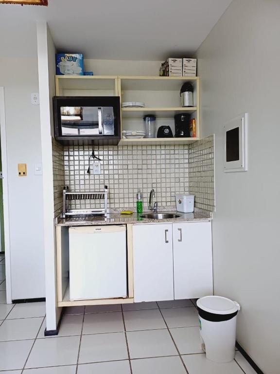 Kuchyň nebo kuchyňský kout v ubytování Gran lençóis Flat 2 suítes vista piscina