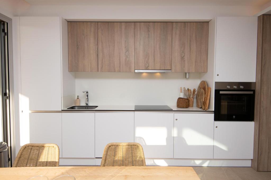 A kitchen or kitchenette at Chic 3BR Haven - Luxury Ground Floor - La Cala Golf