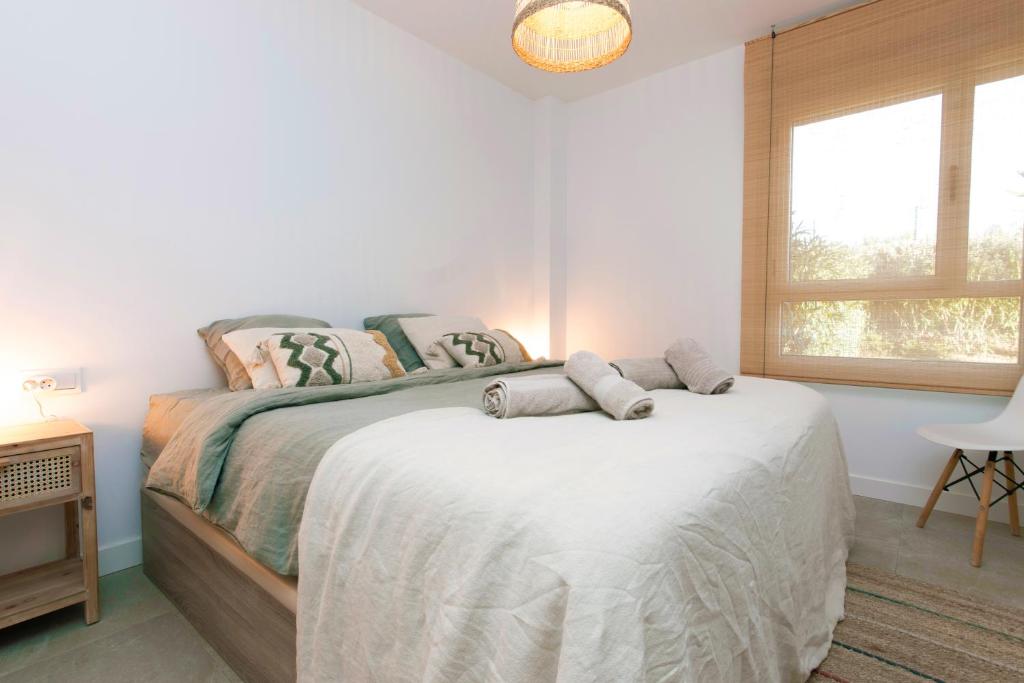 A bed or beds in a room at Chic 3BR Haven - Luxury Ground Floor - La Cala Golf