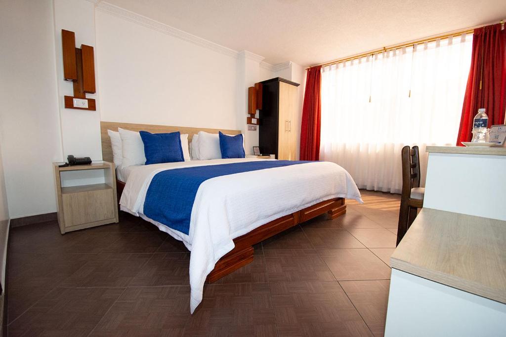 Postel nebo postele na pokoji v ubytování Hotel Plaza Victoria