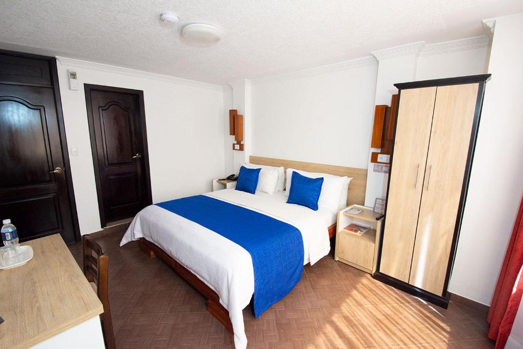 Postel nebo postele na pokoji v ubytování Hotel Plaza Victoria