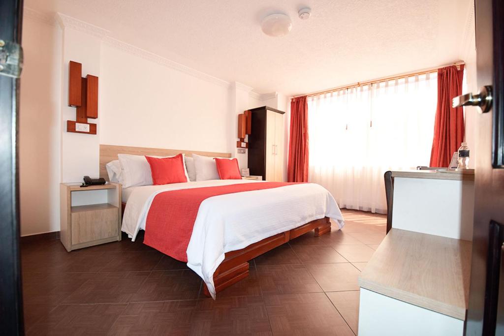 Postel nebo postele na pokoji v ubytování Hotel Plaza Victoria