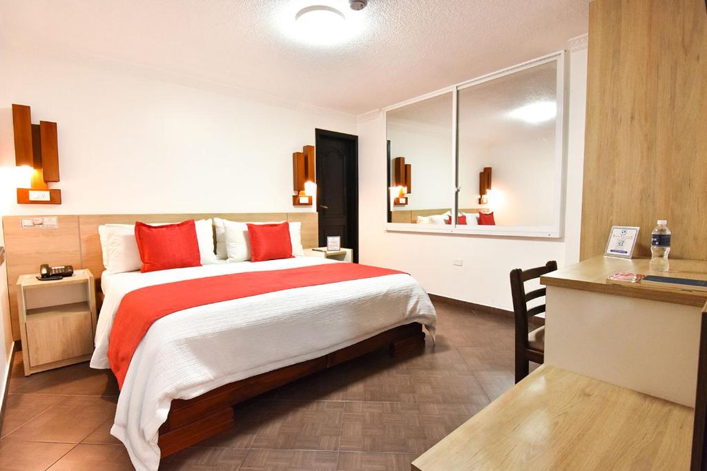 Postel nebo postele na pokoji v ubytování Hotel Plaza Victoria