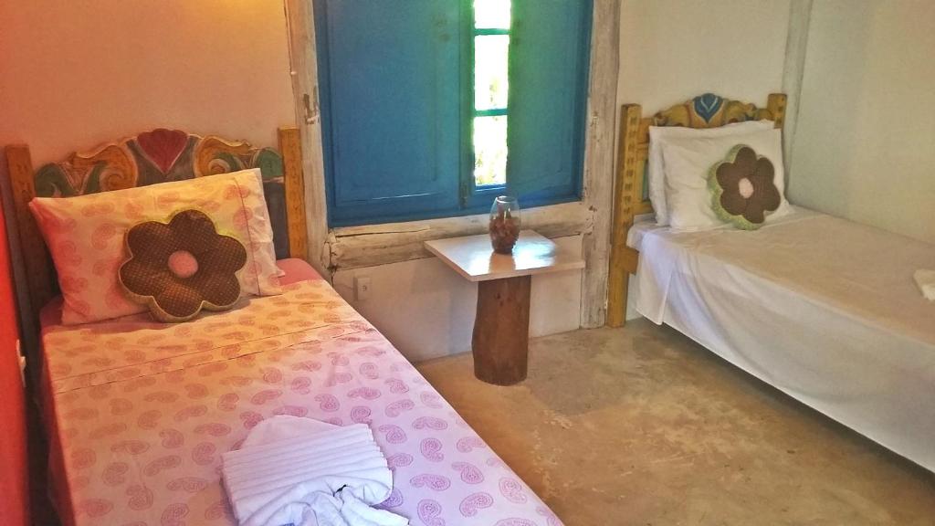 Postel nebo postele na pokoji v ubytování Pousada Casa da Praia Itaúnas