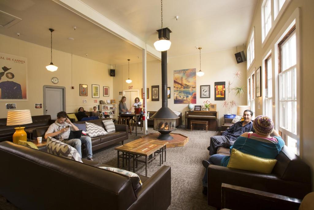 a group of people sitting in a living room at HI San Francisco Fisherman's Wharf Hostel in San Francisco