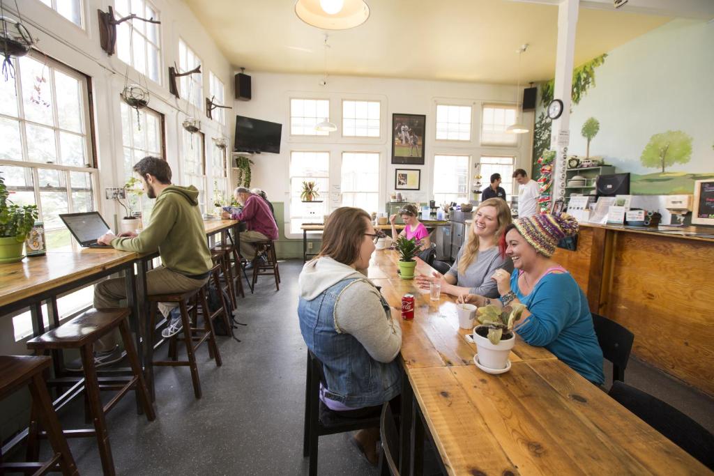 a group of people sitting at a table in a restaurant at HI San Francisco Fisherman's Wharf Hostel in San Francisco