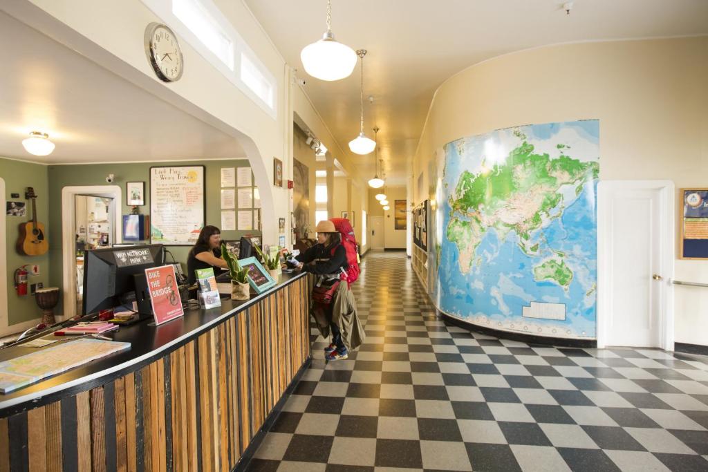 a lobby with a map of the world on the wall at HI San Francisco Fisherman's Wharf Hostel in San Francisco