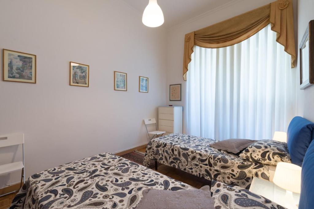 A bed or beds in a room at Leopolda Dream Home