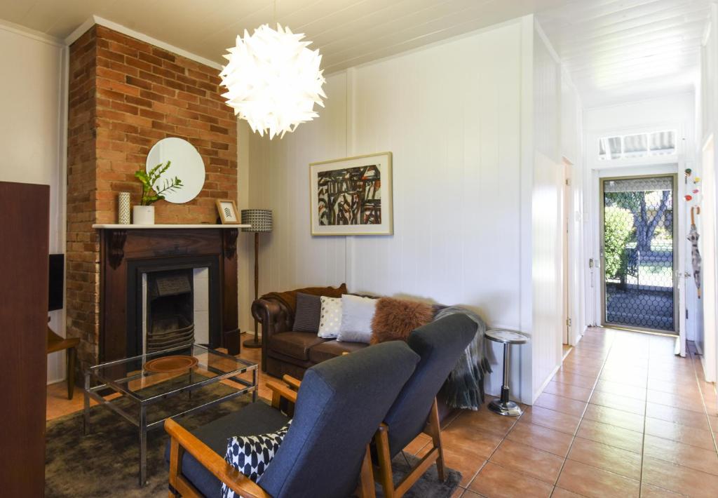 a living room with a couch and a fireplace at The Grey House in Grafton