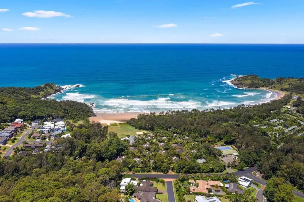 an aerial view of the beach and ocean at Beach Haven @ Diggers in Coffs Harbour