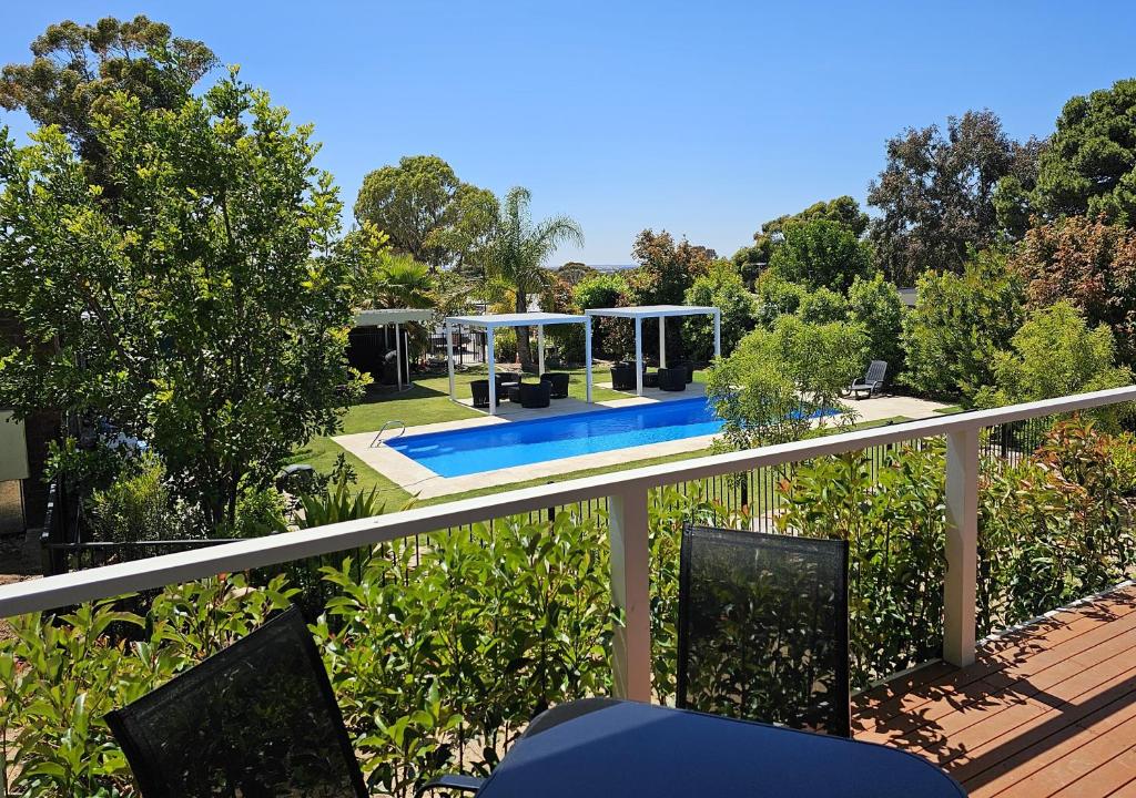 a balcony with a view of a swimming pool at Murray Bridge Tourist Park in Murray Bridge