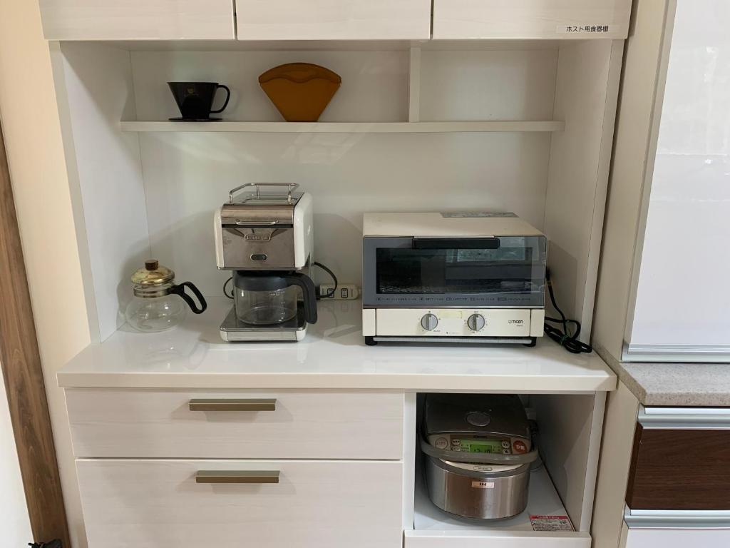 Kuchyň nebo kuchyňský kout v ubytování Vacation Rental あんばええ