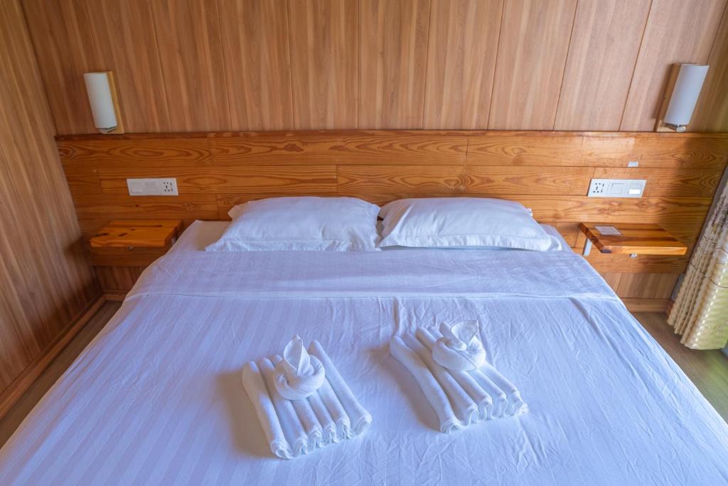 Postel nebo postele na pokoji v ubytování 听海·度假庄园