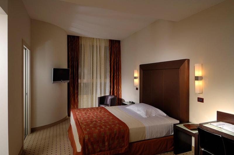 Posteľ alebo postele v izbe v ubytovaní Hotel La Cartiera