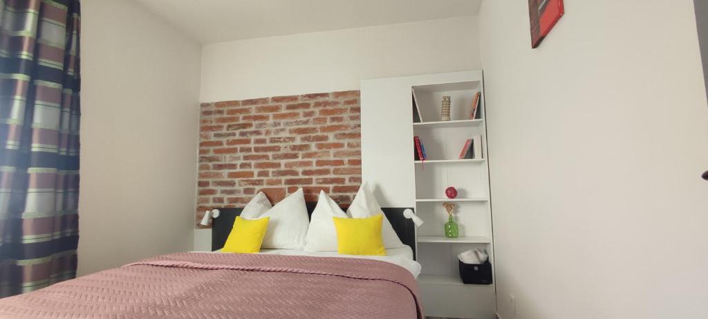 Posteľ alebo postele v izbe v ubytovaní Koller Apartmanház