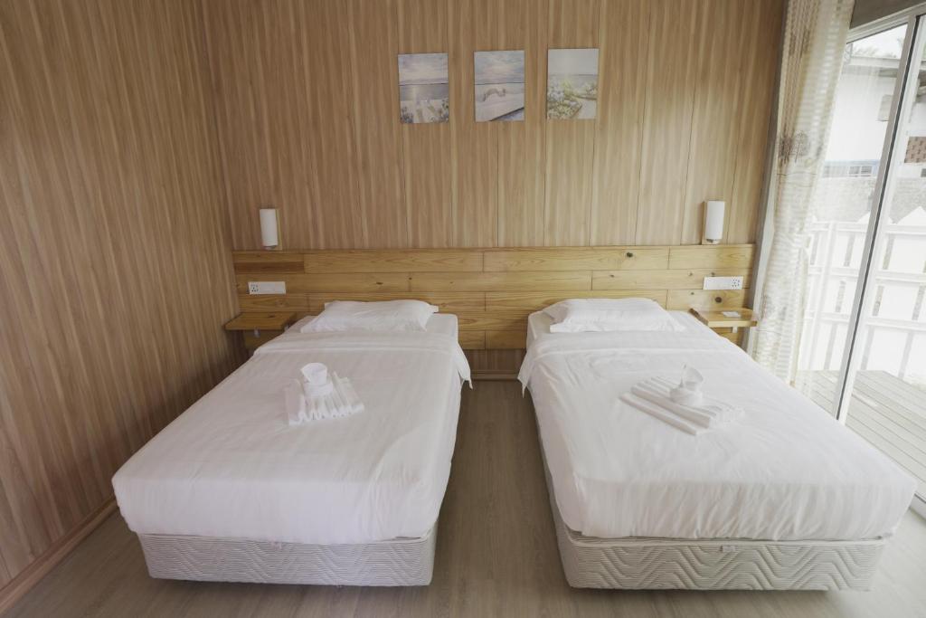Postel nebo postele na pokoji v ubytování 听海·度假庄园