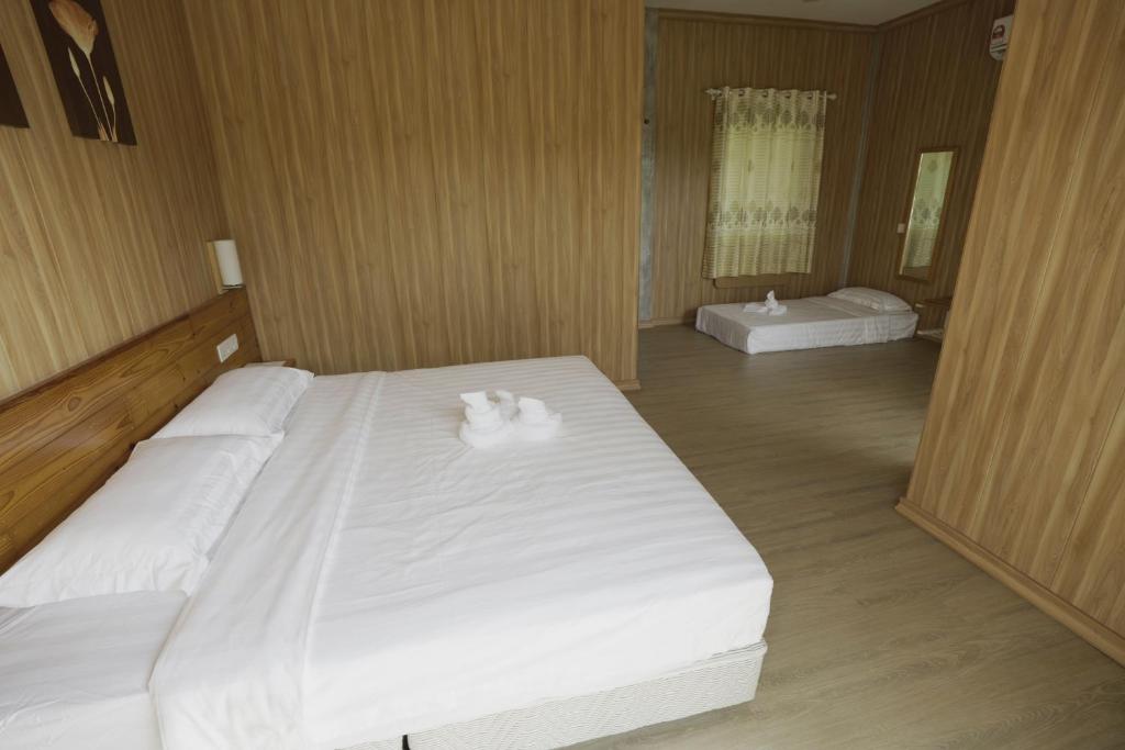 Postel nebo postele na pokoji v ubytování 听海·度假庄园