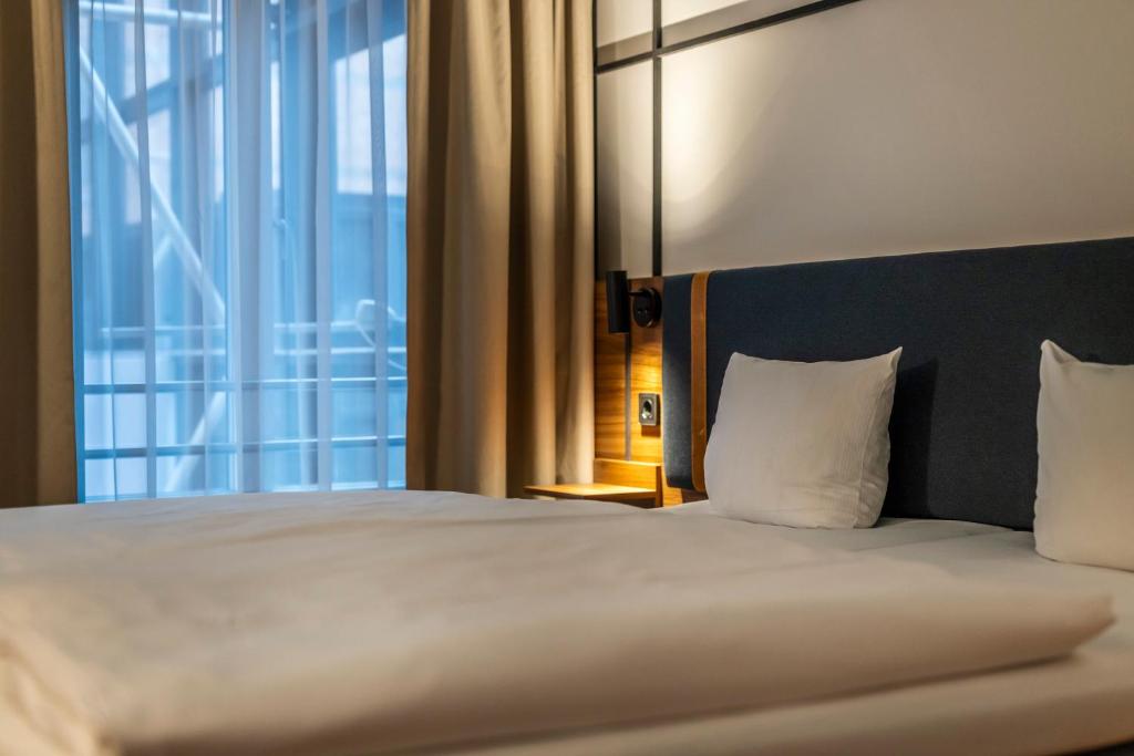 Postel nebo postele na pokoji v ubytování Comfort Hotel Vesterbro
