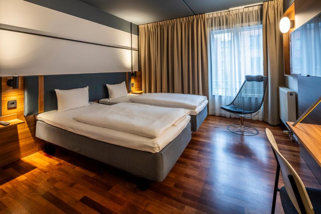 Postel nebo postele na pokoji v ubytování Comfort Hotel Vesterbro