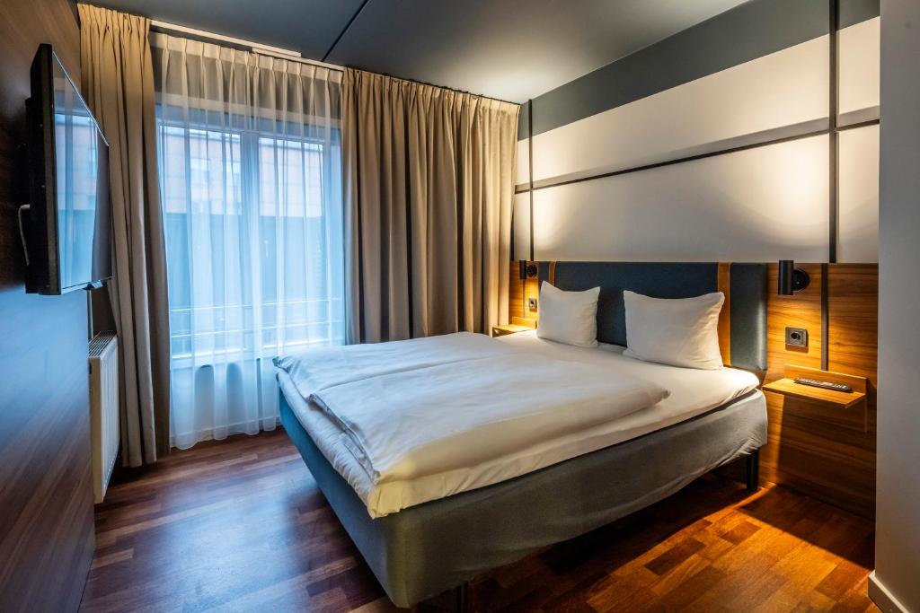 Postel nebo postele na pokoji v ubytování Comfort Hotel Vesterbro
