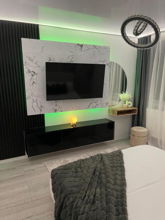 Ένα ή περισσότερα κρεβάτια σε δωμάτιο στο Ideal Residence