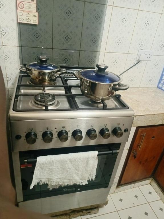 Kuchyň nebo kuchyňský kout v ubytování Vee Apartment