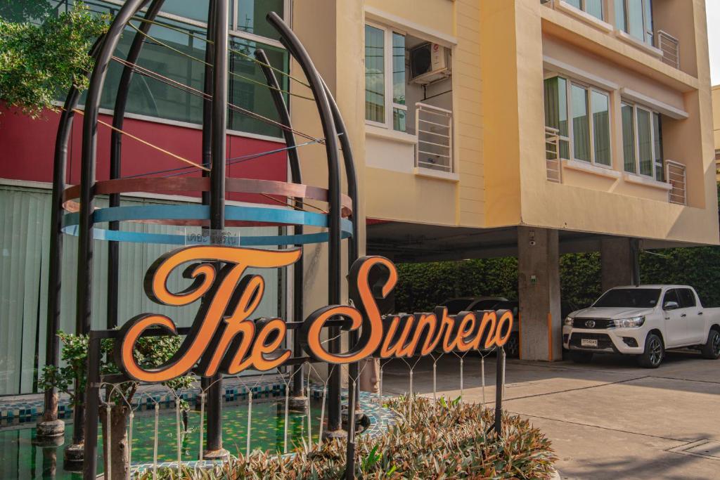 a sign that says the courtyard in front of a building at The Sunreno Hotel SHA in Bangkok