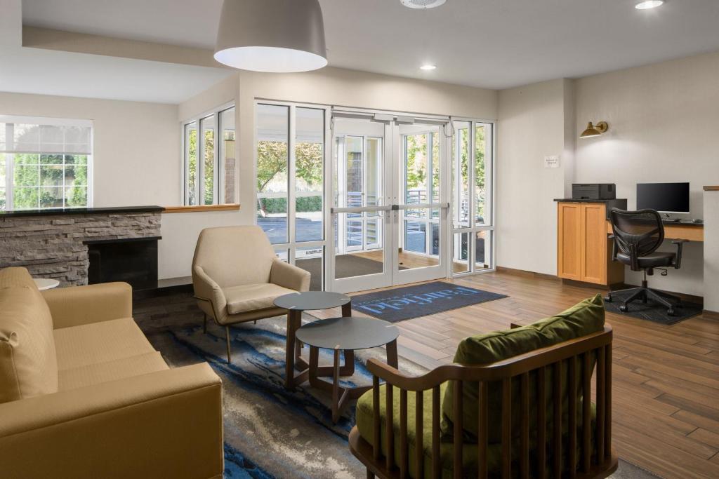 a living room with furniture and a fireplace at Fairfield Inn & Suites Portland West Beaverton in Beaverton