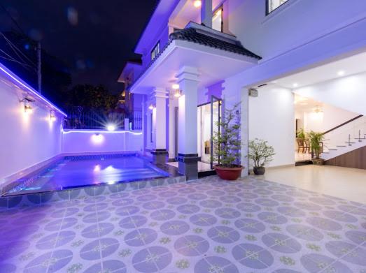 a house with a swimming pool in the yard at Hoàng My Villa D3 in Vung Tau