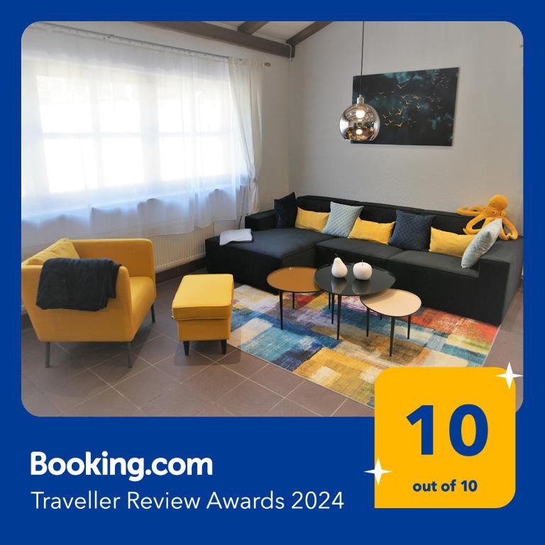 a living room with a couch and a table at Mill Valley Villa in Koblenz