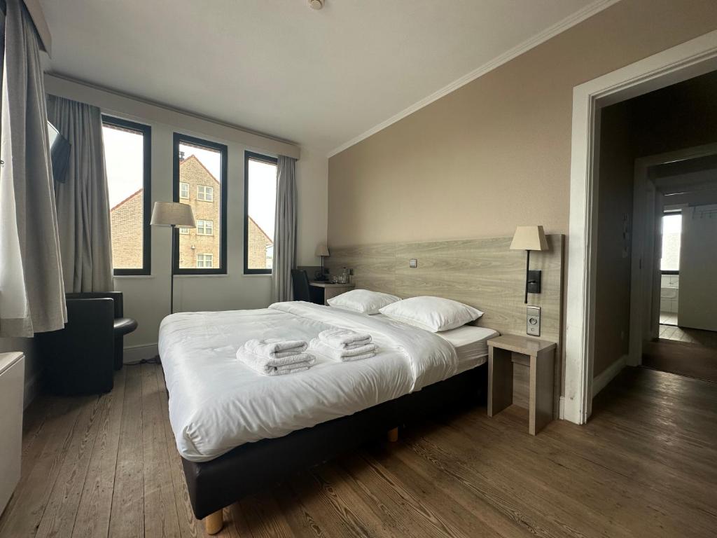 Postel nebo postele na pokoji v ubytování Arriate Hotel
