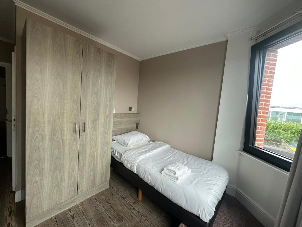 Postel nebo postele na pokoji v ubytování Arriate Hotel