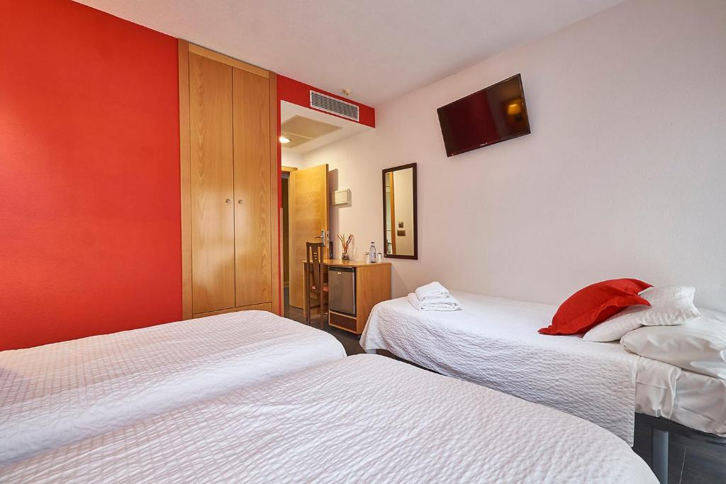 Postel nebo postele na pokoji v ubytování Hotel Real de Illescas