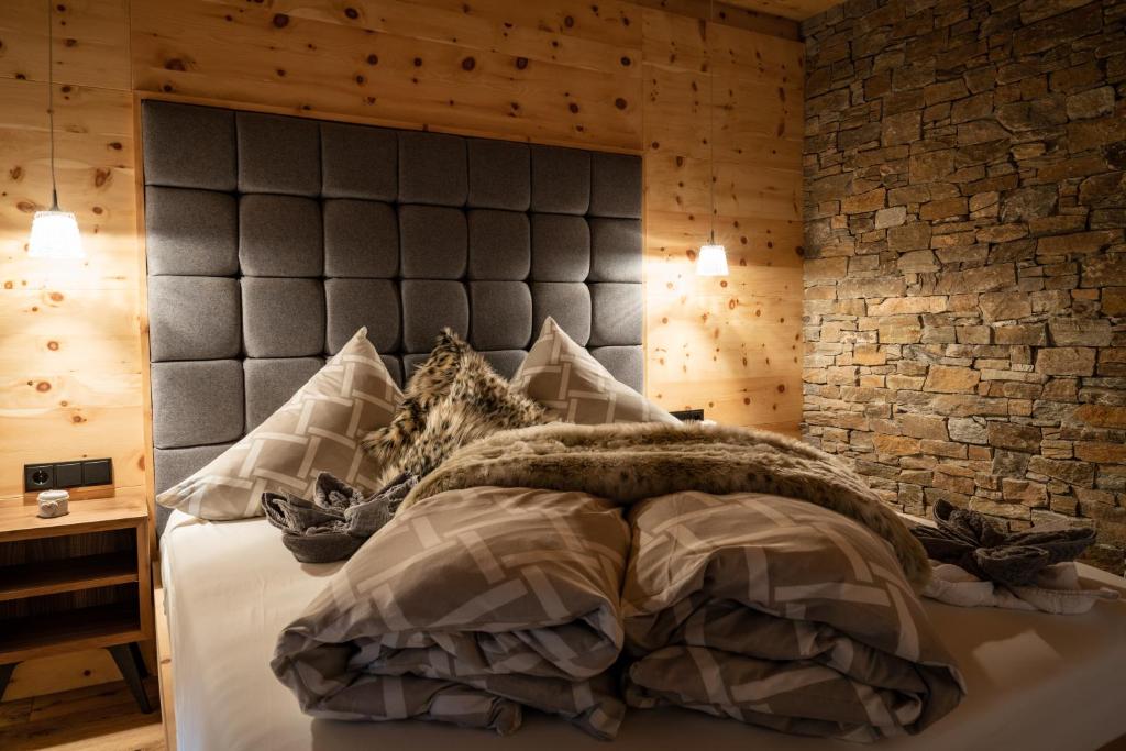 Postel nebo postele na pokoji v ubytování Wochenbrunner Chalets