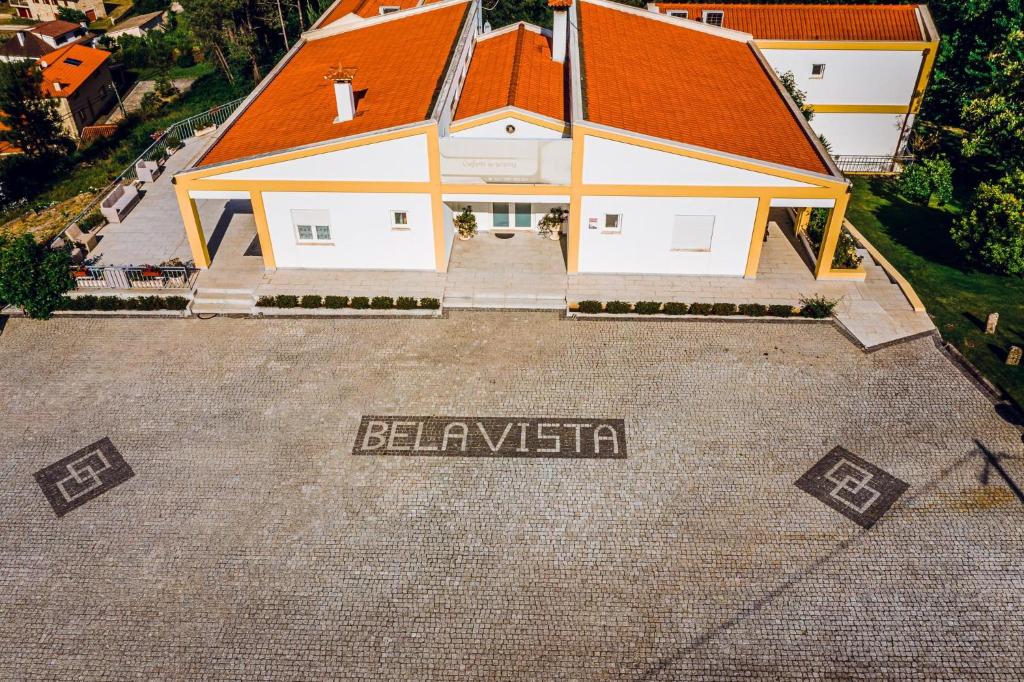 an aerial view of a large house with an orange roof at Estalagem Bela Vista in Mondim de Basto